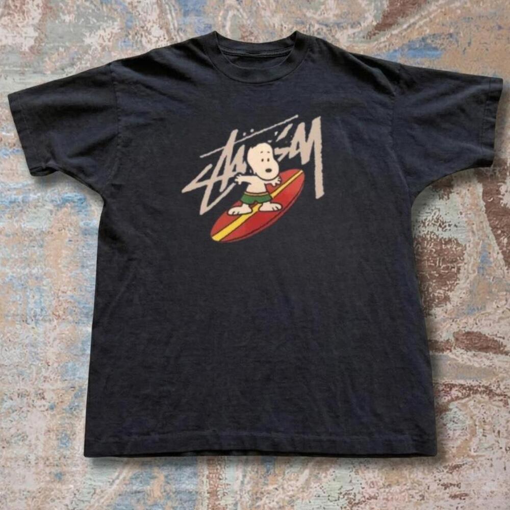 StSsy Black Graphic Tee With Snoopy Surfing Design